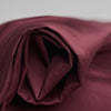 Atelier Brunette Oxford Cotton Fabric in Crispy Brown, a deep burgundy colour