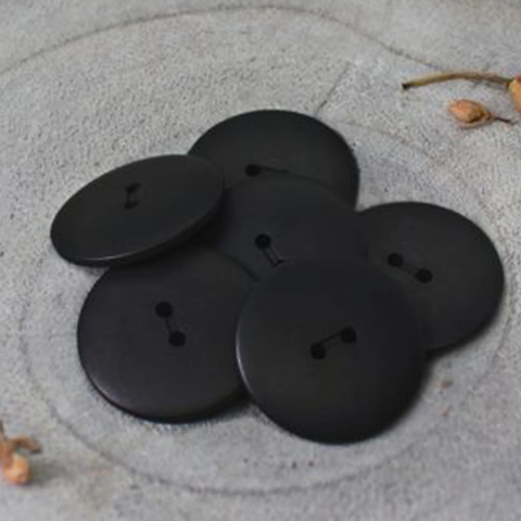 Buy Atelier Brunette Palm Buttons Black 15mm from our trusted UK online fabric shop