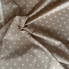 Kokka Polka Dot Cotton Lawn Fabric in Cream on Natural