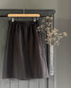 The Assembly Line Shortened A-LIne Midi Skirt pattern in Merchant and Mills Laundered Linen Sweeps Scrim Black